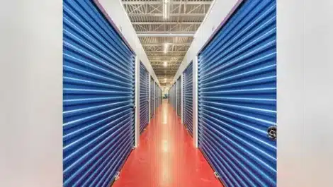 clean, well lit hallway showing indoor storage units